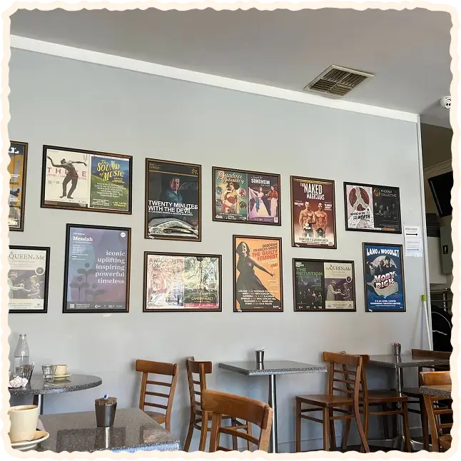 Cosy cafe interior with framed posters on the wall